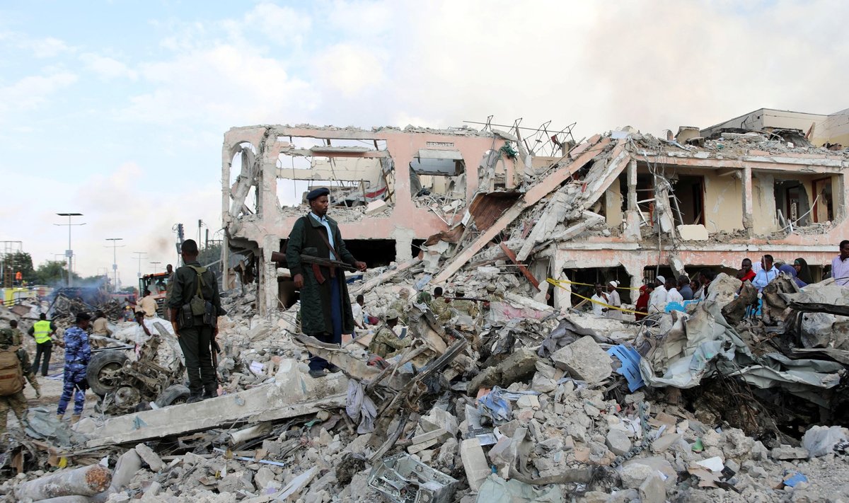 Somali government forces secure the scene of an explosion in KM4 street in the Hodan district of Mogadishu