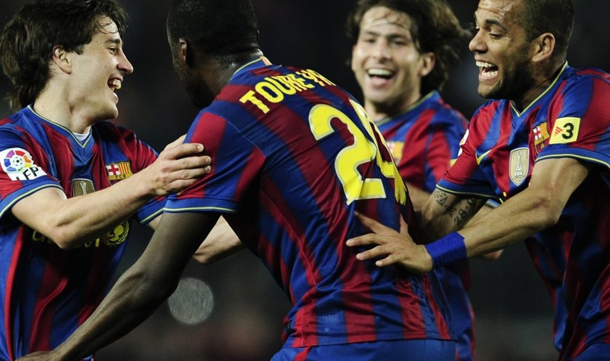 FC Barcelona's Yaya Toure from Cote d'Ivoire, center, celebrates with his teammates Bojan Krkic, left, Daniel Alves from Brazil, right, and Maxwell Scherrer Cabelino Andrade from Brazil after scoring against Deportivo Coruna during their Spanish La Liga soccer match at the Camp Nou stadium in Barcelona, Spain, Wednesday, April 14, 2010. (AP Photo/David Ramos) / SCANPIX Code: 436