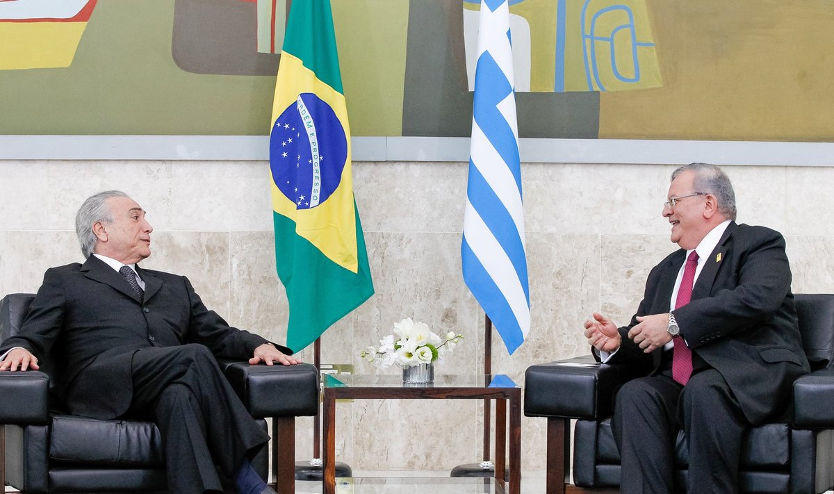 Greece's ambassador to Brazil Amiridis talks to Brazil's President Temer during a government ceremony in Brasilia
