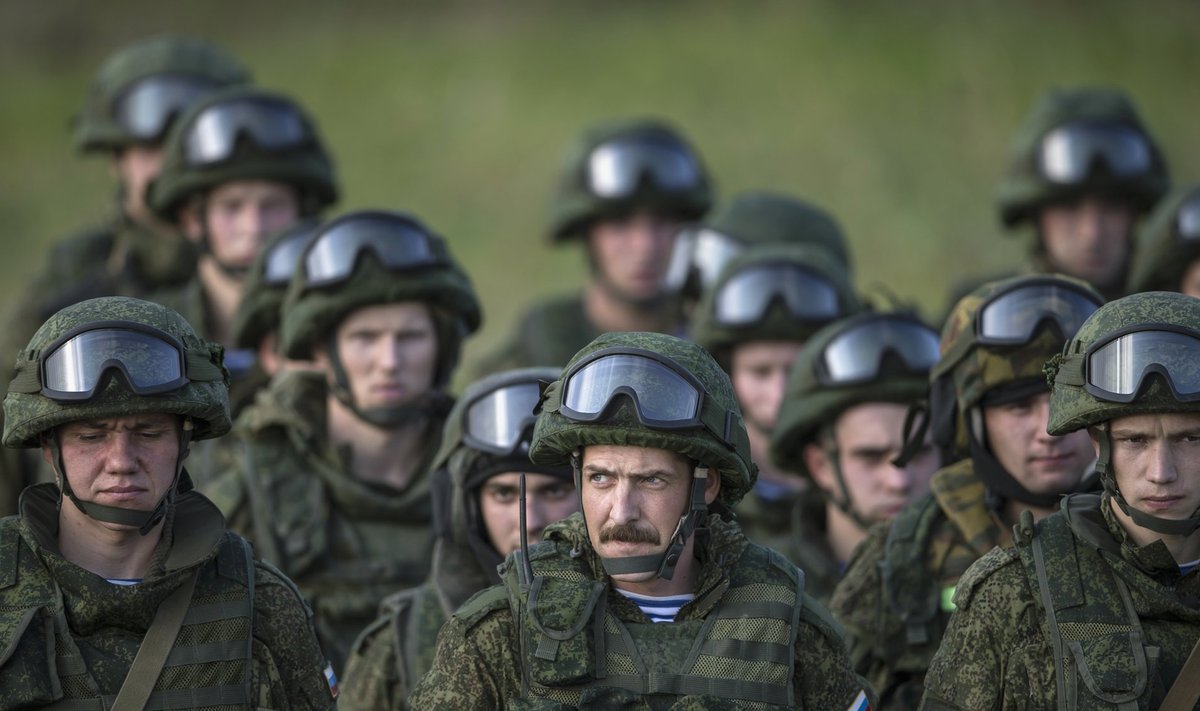 Russian troops stand after a training exercise in the village of Nikinci