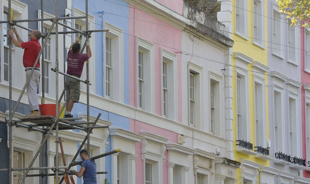 Scaffolders work on a residential street in Notting Hill in central London