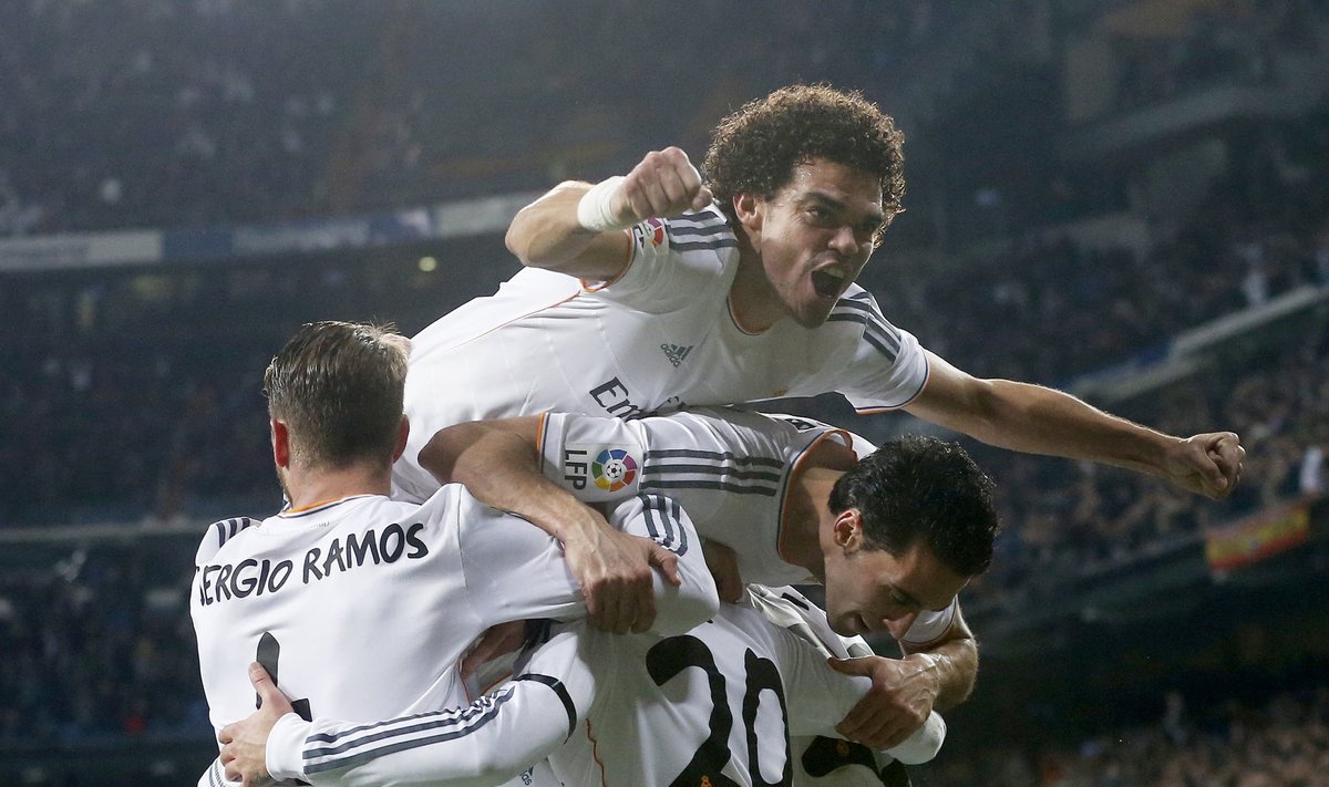 Real Madrid's Pepe celebrate their team's second goal with teammates during their Spanish King's Cup semi-final first leg soccer match against Atletico Madrid at Santiago Bernabeu stadium in Madrid