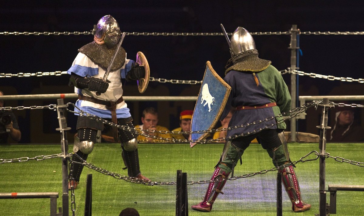 An Israeli competitor fights a Belarus competitor during the "World Medieval Fighting Championship - the Israeli Challenge" in Rishon Letzion near Tel Aviv