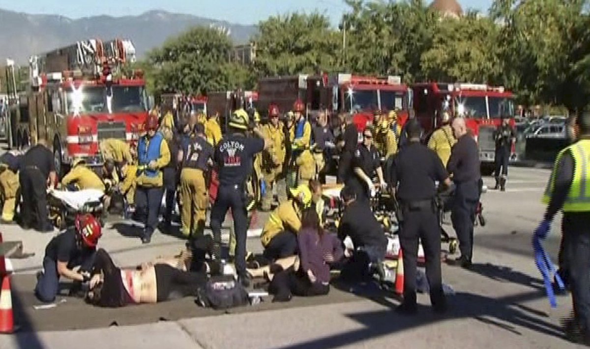 Still from video shows rescue crews tending to the injured in the intersection outside the Inland Regional Center in San Bernardino