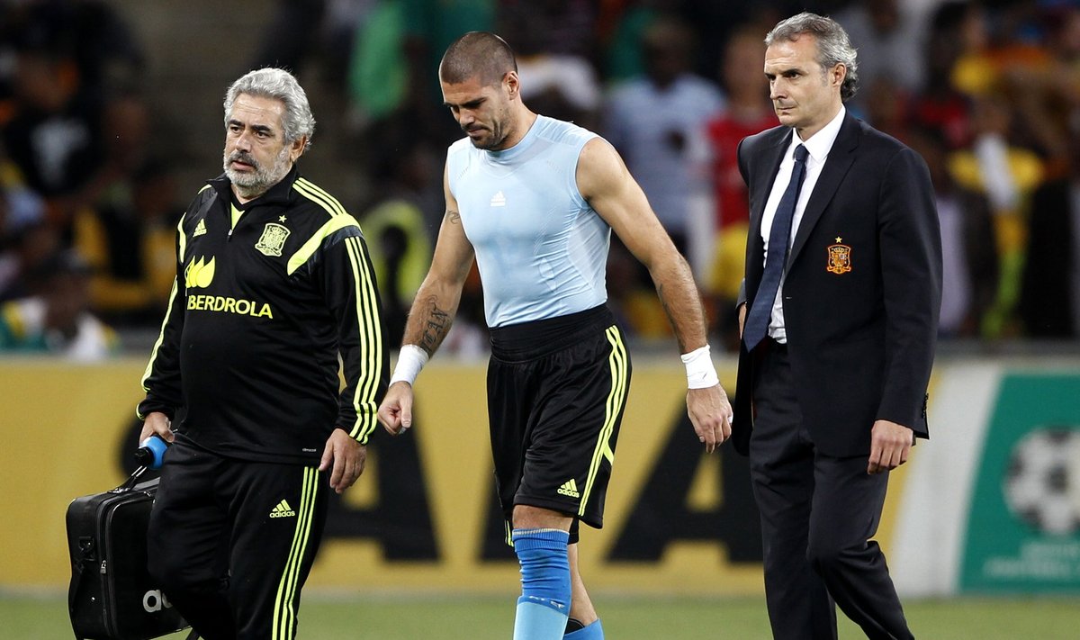 Spain's goalkeeper Valdes is escorted off the field during their international friendly soccer match against South Africa in Johannesburg