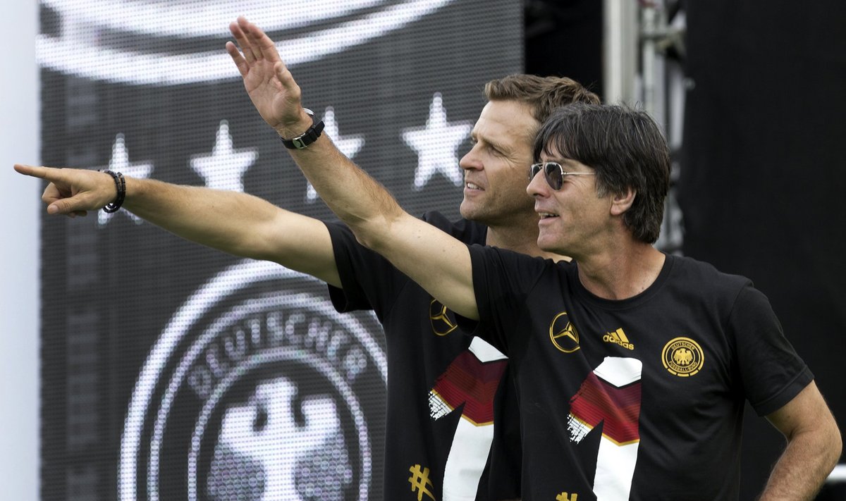 Germany's team manager Bierhoff and head coach Loew applaud fans during celebrations at 'fan mile' in Berlin