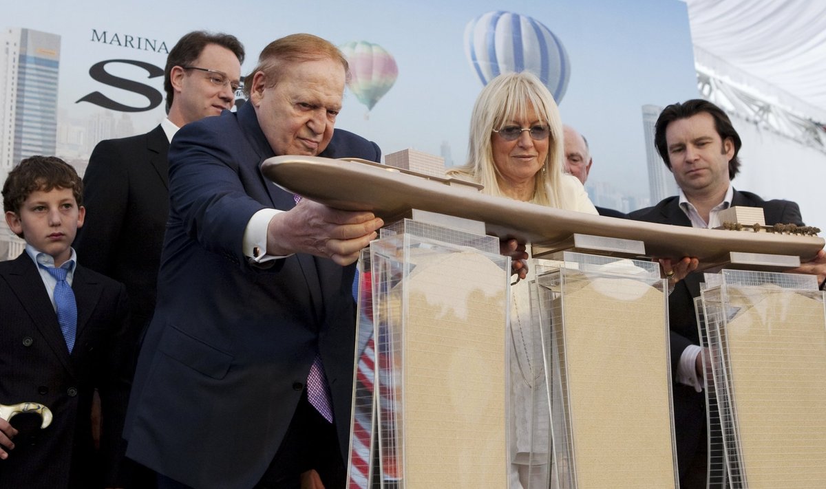 File photo of Las Vegas Sands Chairman Sheldon Adelson and his wife attending the Marina Bay Sands Casino hotel towers' topping out ceremony in Singapore