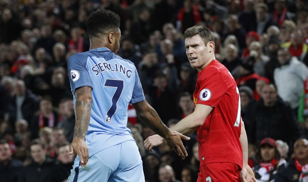 Manchester City's Raheem Sterling clashes with Liverpool's James Milner