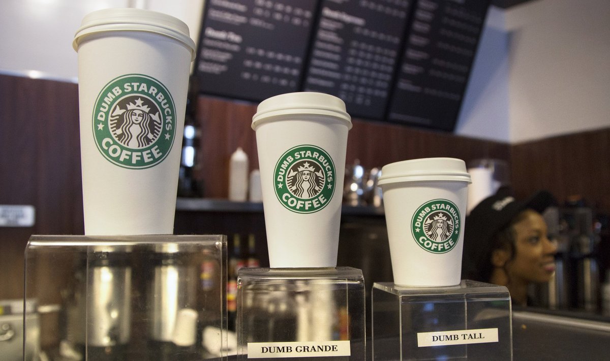 Cups stand on display cases at "Dumb Starbucks", a parody store of the Starbucks Coffee chain, in Los Angeles