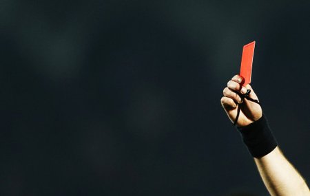 Referee Laurent Duhamel shows a red card to Maxime Poundje of Girondins Bordeaux during his French Ligue 1 soccer match against Toulouse at the Chaban Delmas Stadium in Bordeaux
