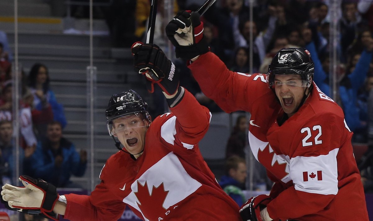 Canada's Benn celebrates his goal against Team USA with teammate Perry during the second period of the men's ice hockey semi-final game at the 2014 Sochi Winter Olympic Games