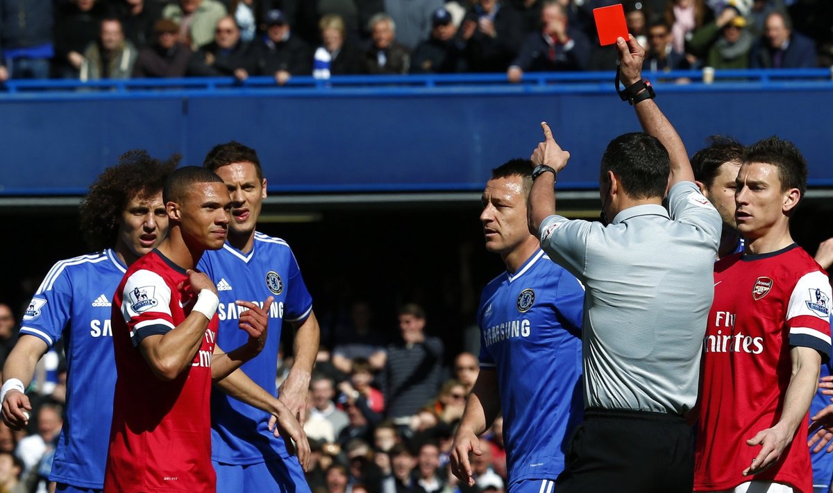 Arsenal's Gibbs is shown a red card by referee Marriner during their English Premier League soccer match against Chelsea at Stamford Bridge in London