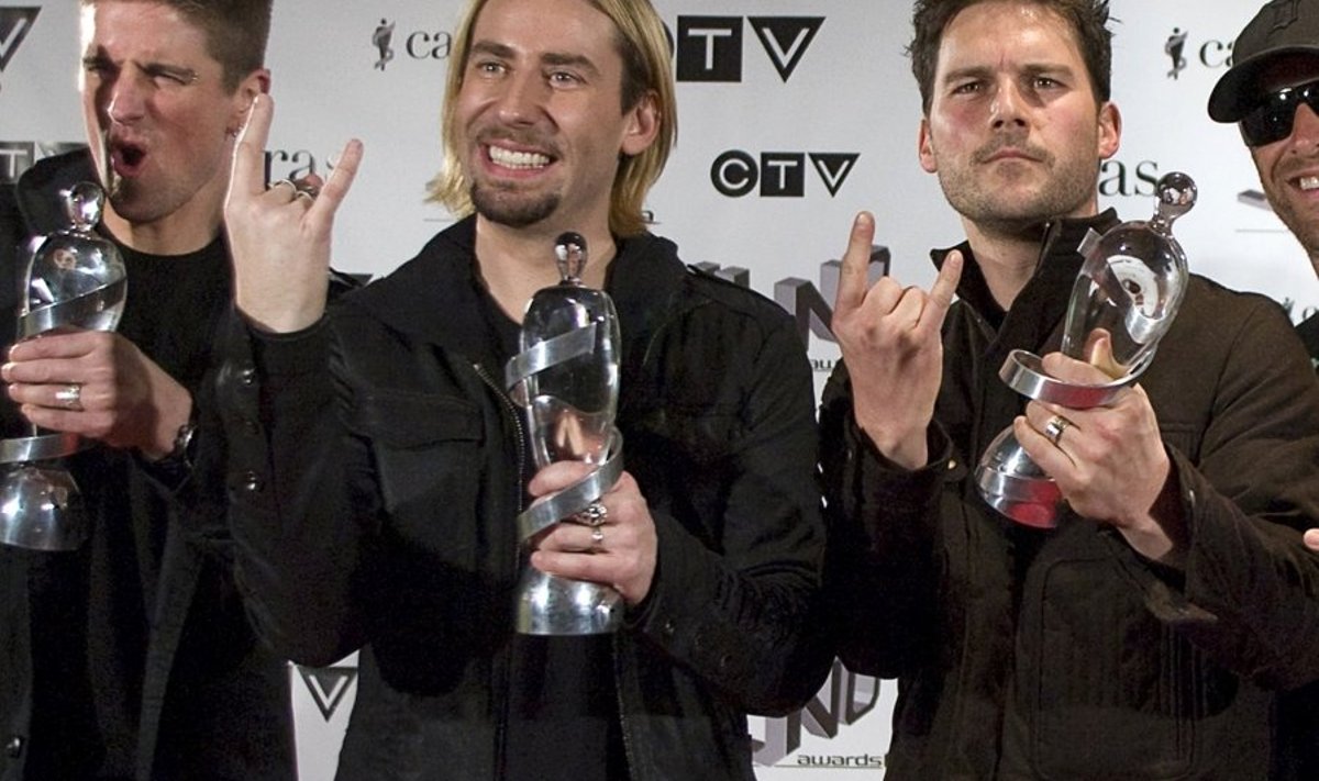 Members of Nickelback pose with their three awards for Fan Choice, Album of the Year and Group of the Year during the Juno Awards in Vancouver, British Columbia March 29, 2009. Band members are (L-R) Daniel Adair, Chad Kroeger, Ryan Peake and Mike Kroeger.         REUTERS/Richard Lam     (CANADA ENTERTAINMENT)