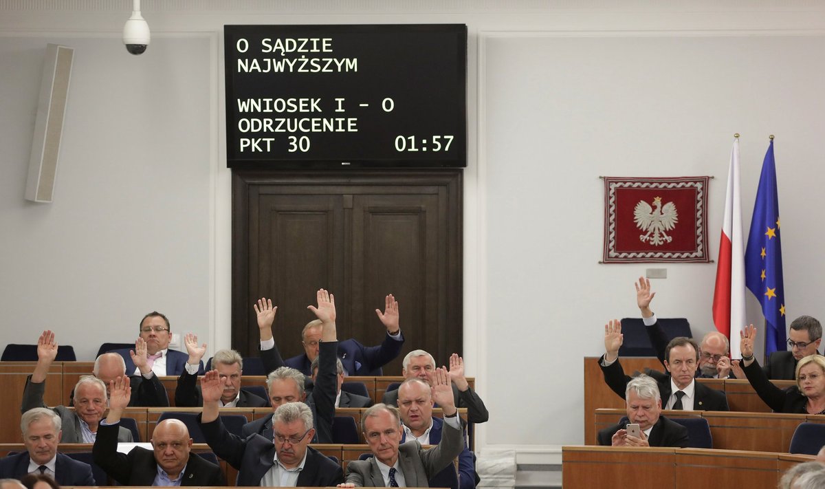 Senators vote during a senate session about supreme court legislation at the Polish parliament in Warsaw