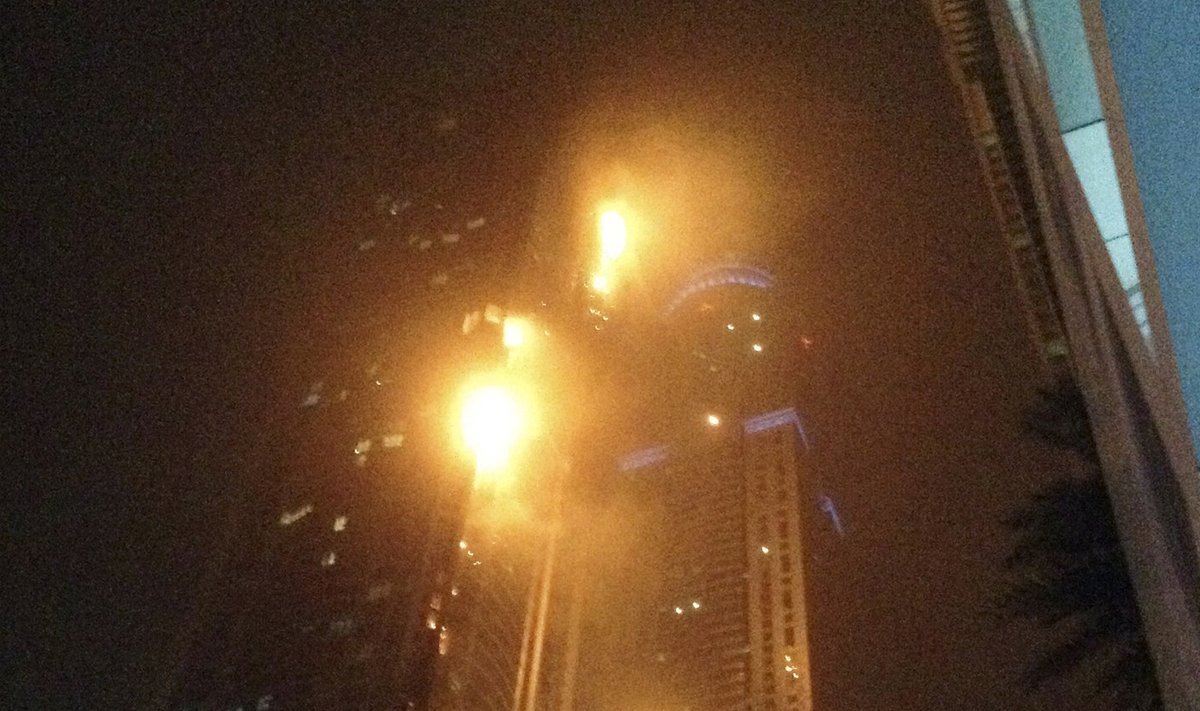 A fire blazes at "The Torch", a residential high-rise tower, in Dubai