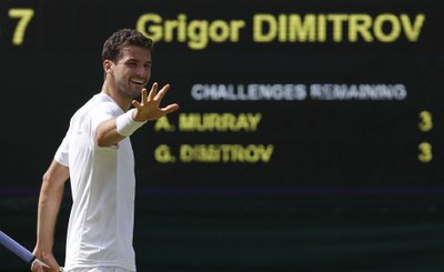 Grigor Dimitrov of Bulgaria reacts after defeating Andy Murray of Britain in their men's singles quarter-final tennis match at the Wimbledon Tennis Championships, in London