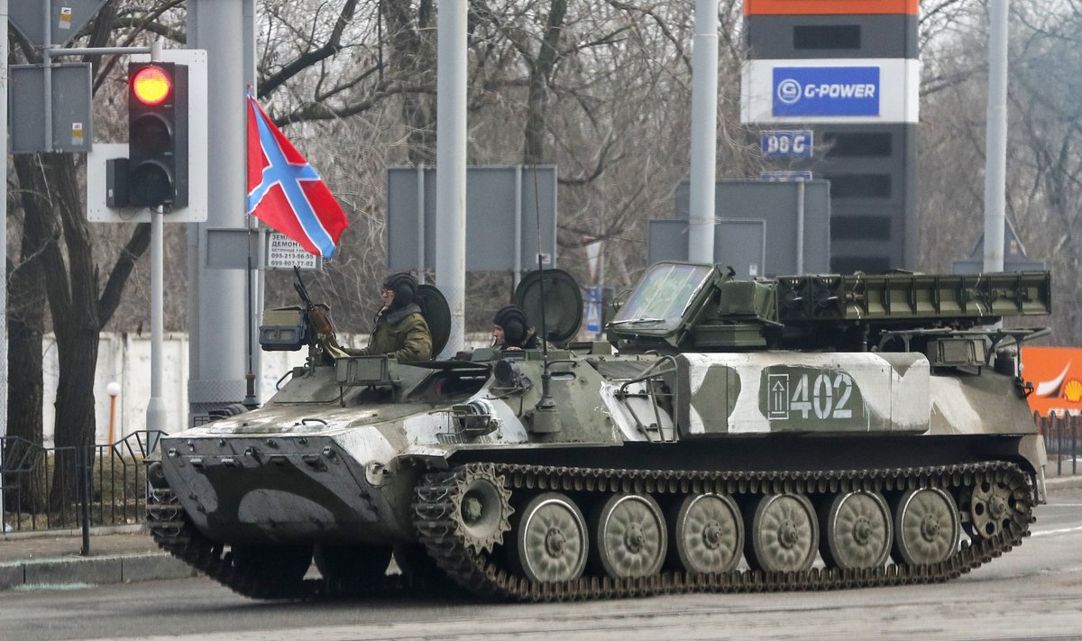 Pro-Russian rebels drive a self-propelled anti-aircraft system Strela-10 in Donetsk