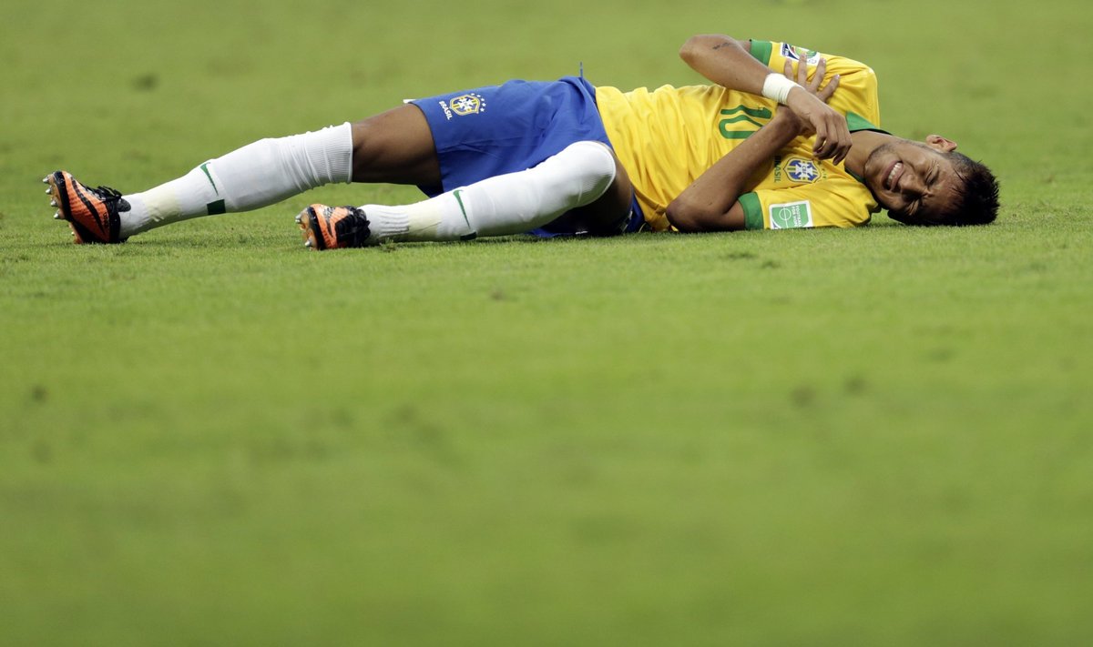 Brazil's Neymar lies injured on the field during their Confederations Cup semi-final soccer match against Uruguay at the Estadio Mineirao in Belo Horizonte