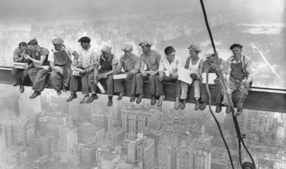 Construction workers eat their lunch atop a steel beam 800 feet above the ground, at the construction site for the RCA Building at the Rockefeller Center, in New York in this handout photo dated September 20, 1932. The historic image "Lunch atop a Skyscraper" was taken 80 years ago. 