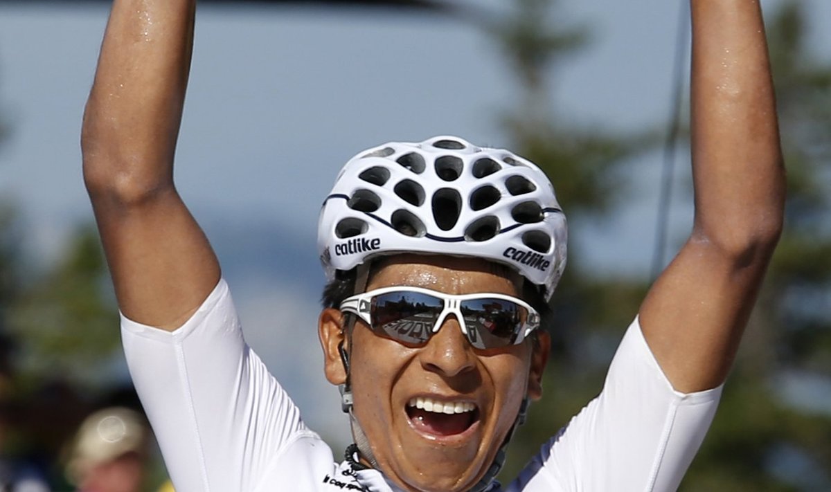 Movistar team rider Quintana of Colombia celebrates as he crosses the finish line to win the 125 km stage of the centenary Tour de France cycling race from Annecy to Annecy-Semnoz