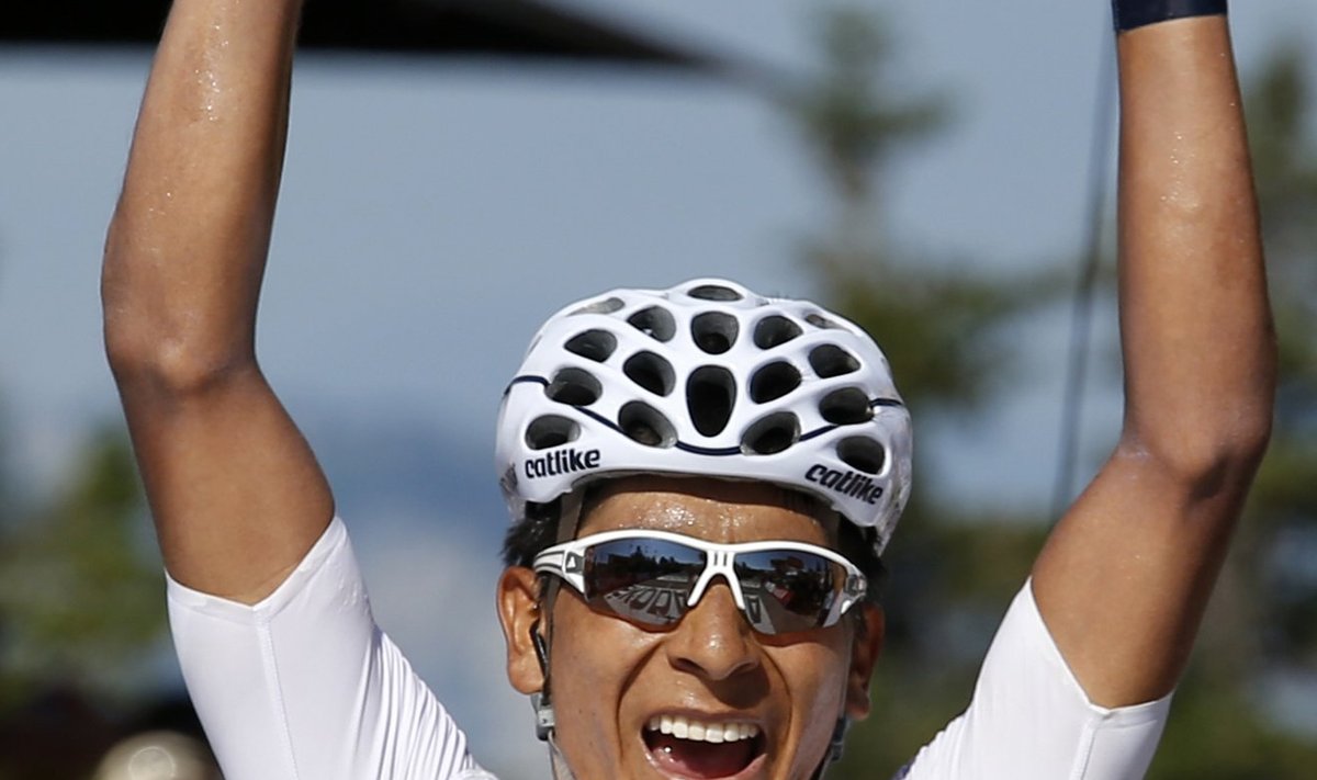 Movistar team rider Quintana of Colombia celebrates as he crosses the finish line to win the 125 km stage of the centenary Tour de France cycling race from Annecy to Annecy-Semnoz