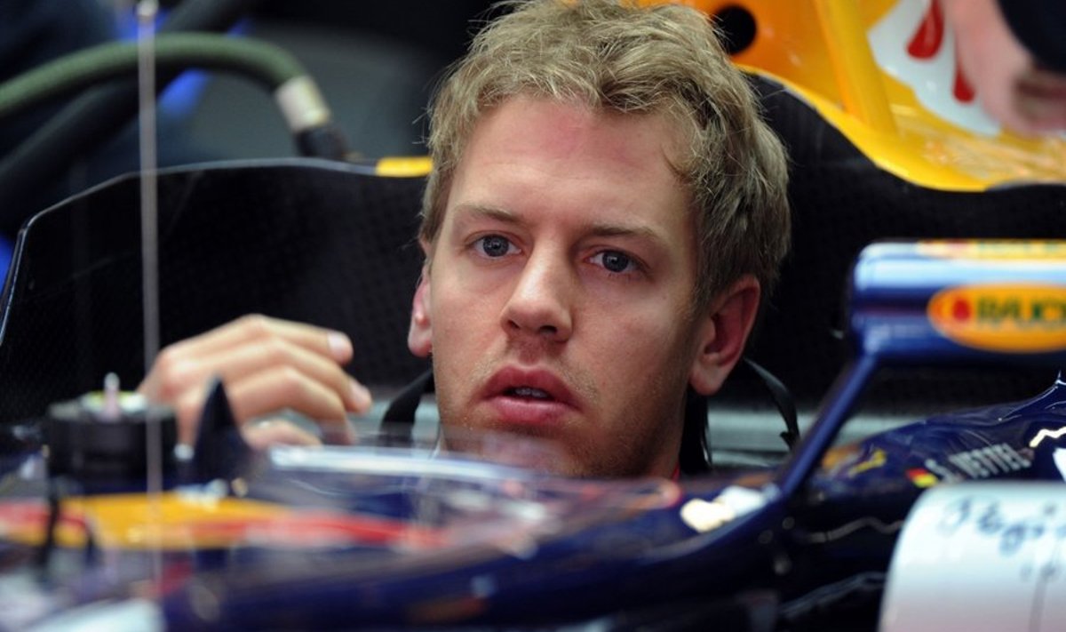 Red Bull's German driver Sebastian Vettel sits in his car in the pits of the circuit de Catalunya on May 7, 2010 in Montmelo, near Barcelona, during the first free practice session of the Formula One Grand Prix of Spain.        AFP PHOTO / FRED DUFOUR