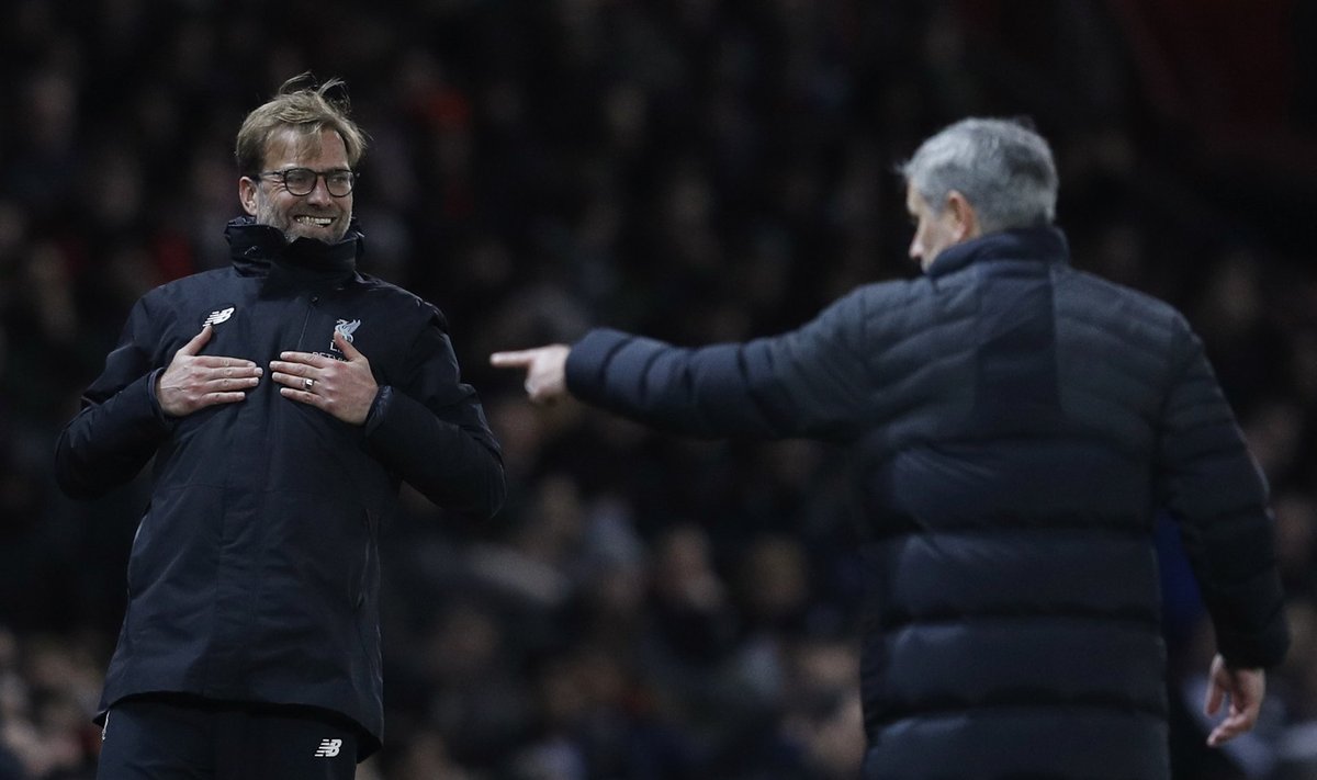 Liverpool manager Juergen Klopp reacts as Manchester United manager Jose Mourinho looks on