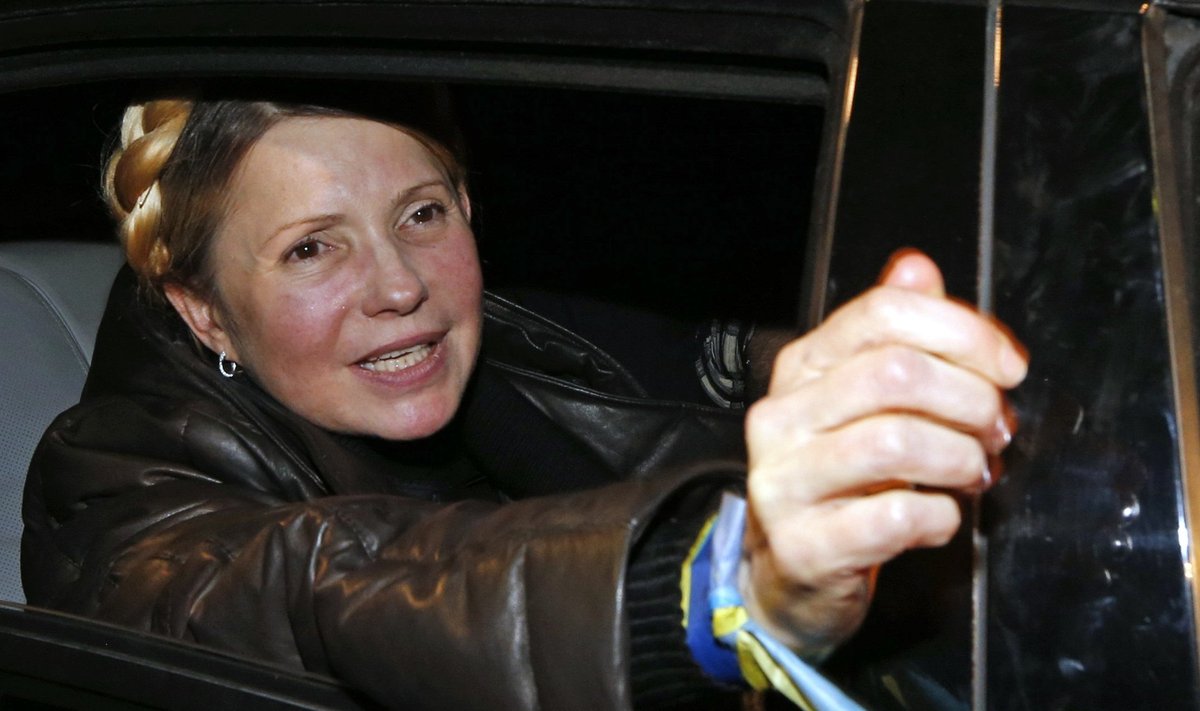 Ukrainian opposition leader Tymoshenko reacts at the airport in Kiev