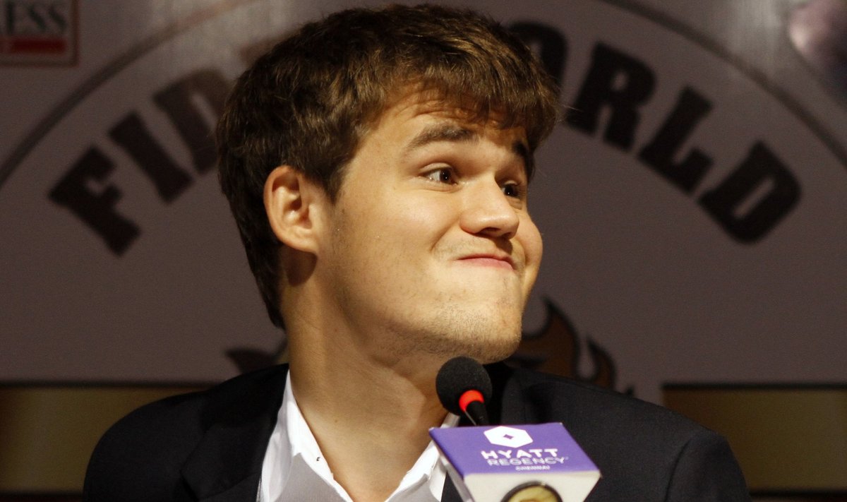 Norway's Magnus Carlsen reacts during a news conference after clinching the FIDE World Chess Championship in Chennai