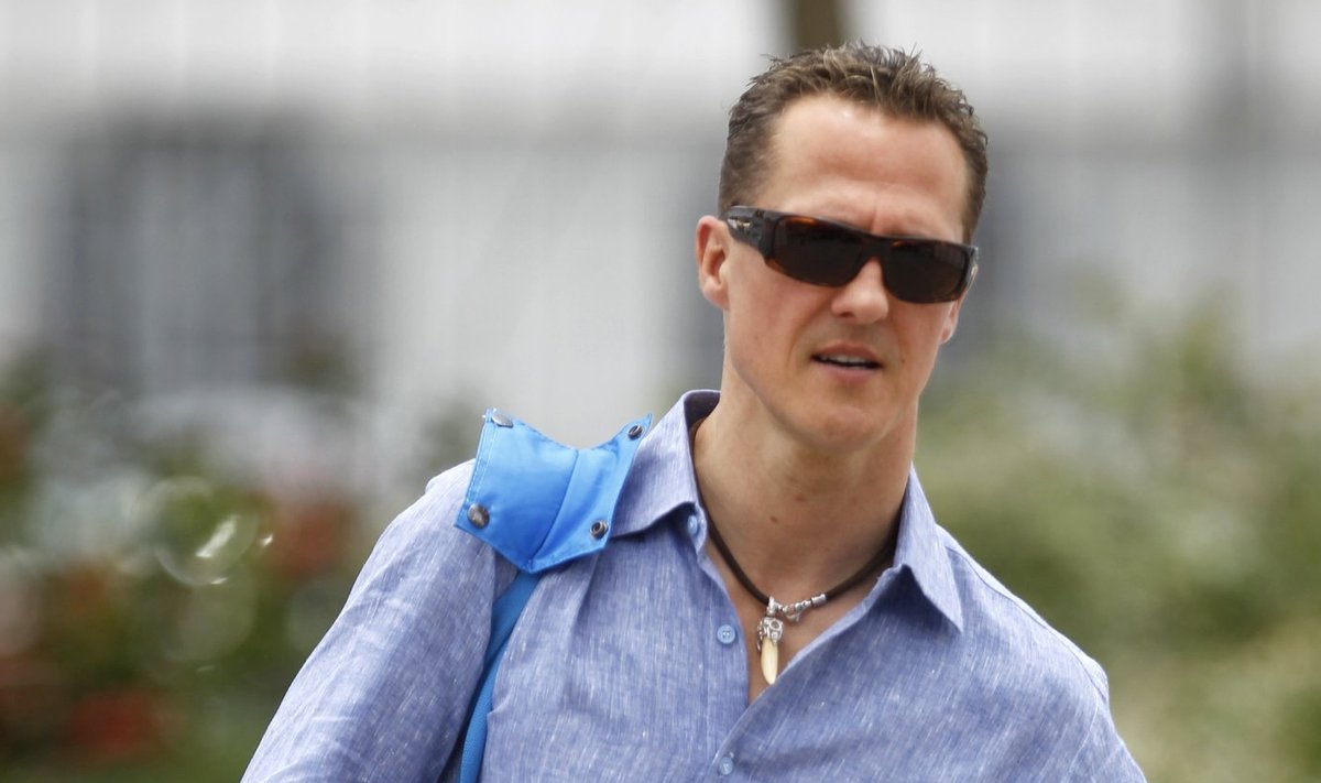 Mercedes Formula One driver Michael Schumacher of Germany arrives at the paddock ahead of the Malaysian F1 Grand Prix at the Sepang circuit outside Kuala Lumpur