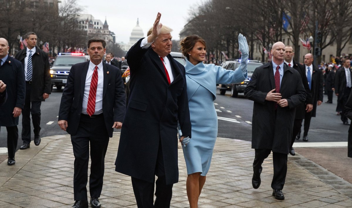 President Donald Trump and first lady Melania Trump walk along the Inauguration Day parade route after being sworn in as the 45th President of the United States,