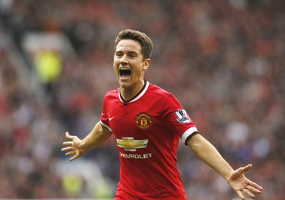 Manchester United's Herrera celebrates scoring a goal against Queens Park Rangers during their English Premier League soccer match at Old Trafford in Manchester