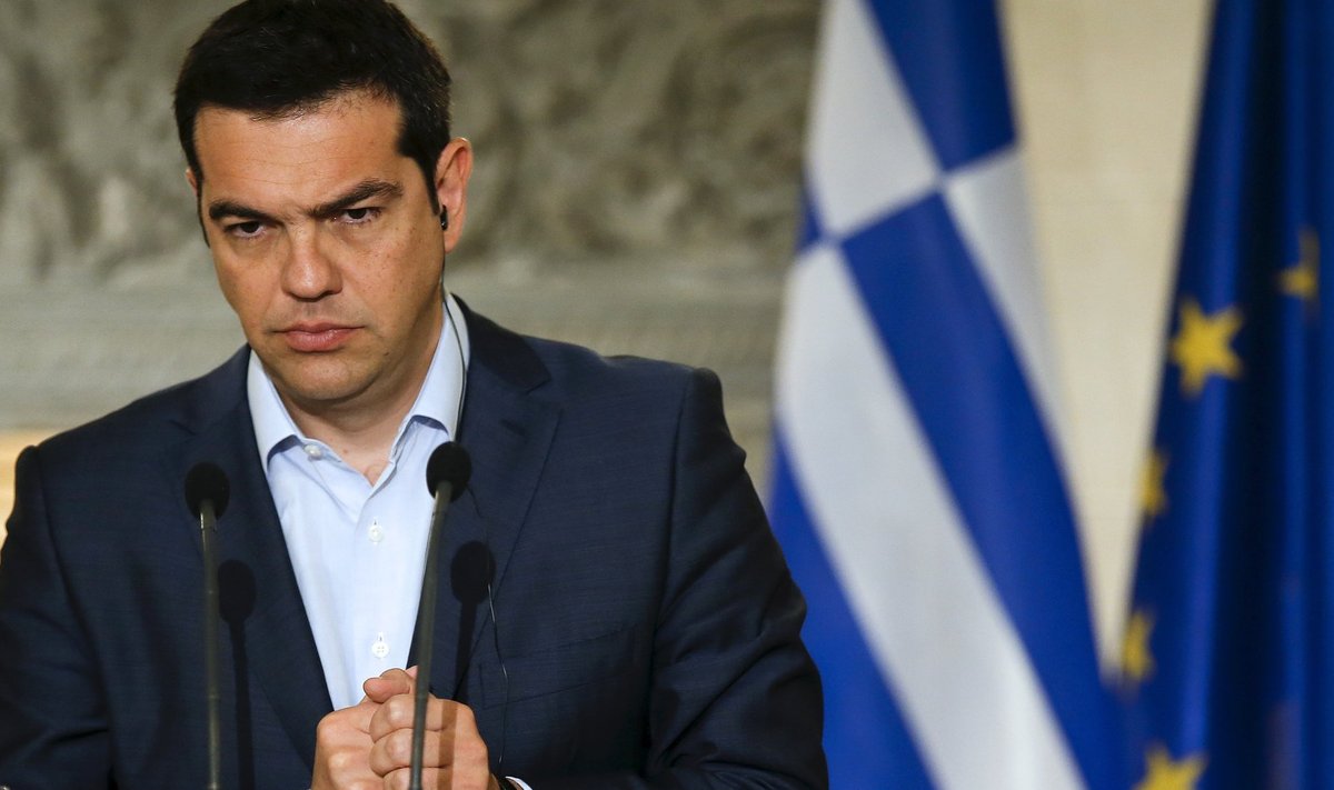 Greek PM Tsipras gestures during a news conference in Athens