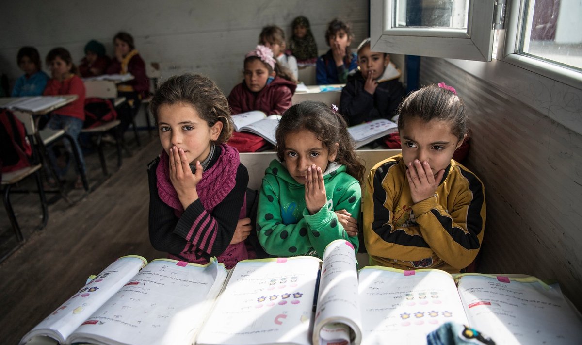 Süüria lapsed koolitunnis