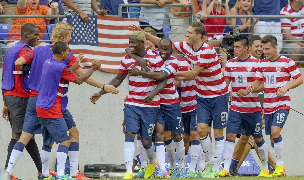 Johnson of the U.S. is congratulated by teammates after scoring a goal during the second half of  their CONCACAF Gold Cup quarter-final soccer match against El Salvador in Baltimore