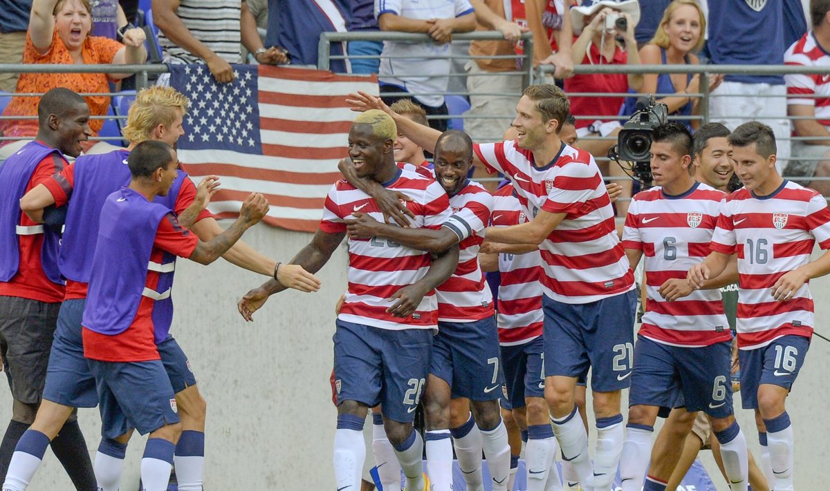 Johnson of the U.S. is congratulated by teammates after scoring a goal during the second half of  their CONCACAF Gold Cup quarter-final soccer match against El Salvador in Baltimore