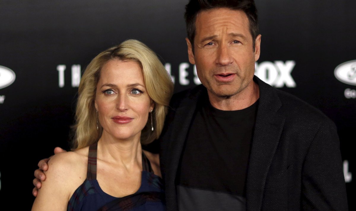 Cast members Gillian Anderson and David Duchovny pose at a premiere for "The X-Files" at California Science Center in Los Angeles, California