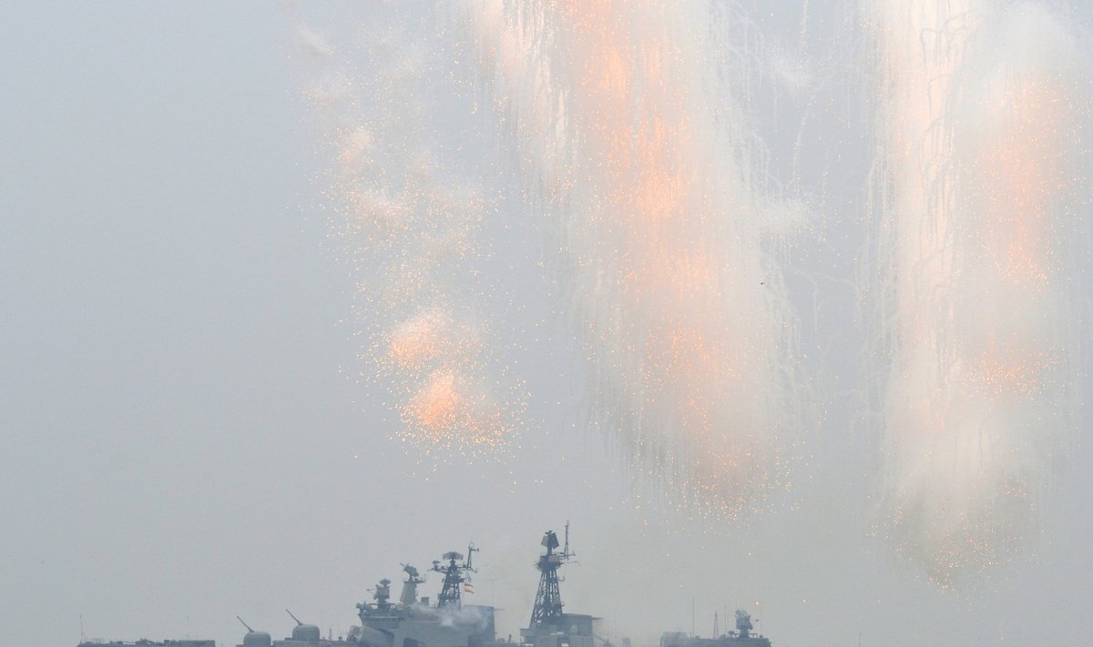 A Russian warship fires during a naval parade rehearsal in the far eastern port of Vladivostok