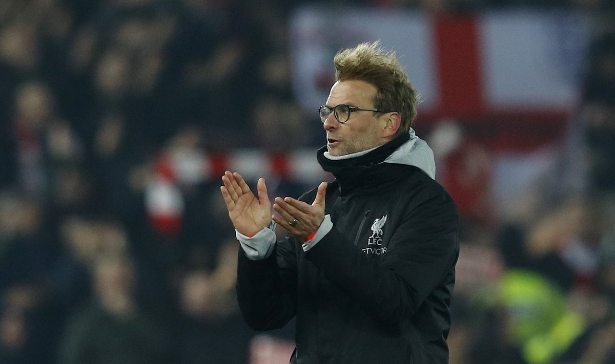 Liverpool manager Juergen Klopp applauds fans after the game