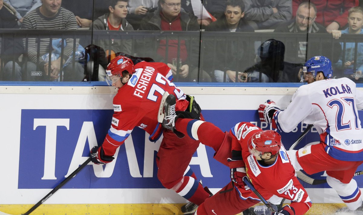 Czech Kolar collides with Russia's Fishchenko and Timkin during their Euro Hockey Tour ice hockey match in Prague