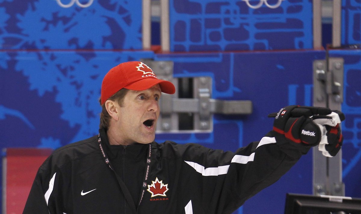 Canada's coach Babcock talks to his team during their ice practice at the Vancouver 2010 Winter Olympics