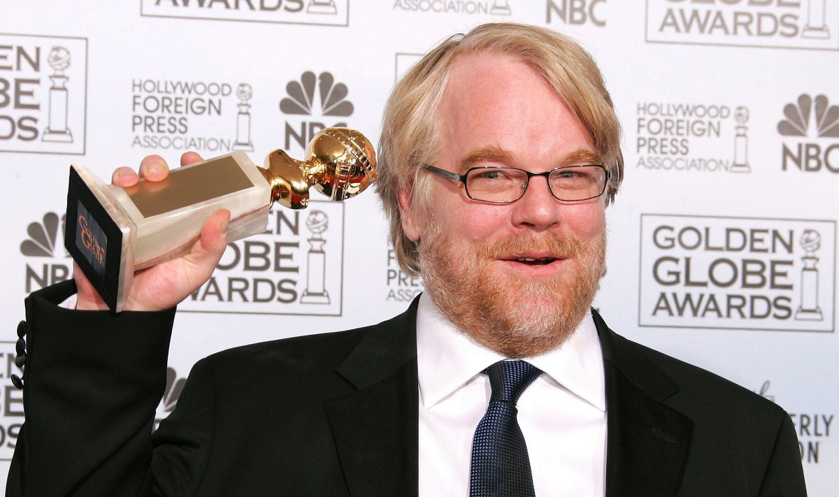 File photo of Philip Seymour Hoffman posing with his award in Beverly Hills