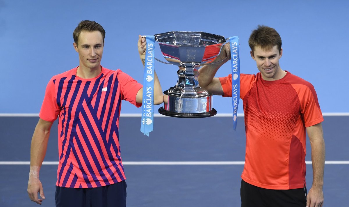 Finland's Henri Kontinen and Australia's John Peers celebrate winning the doubles with the trophy after defeating South Africa's Raven Klaasen and USA's Rajeev Ram