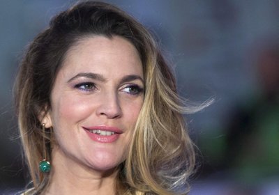 FILE PHOTO: U.S. actress Drew Barrymore poses for photographers at the European premiere of the film "Miss You Already" in London