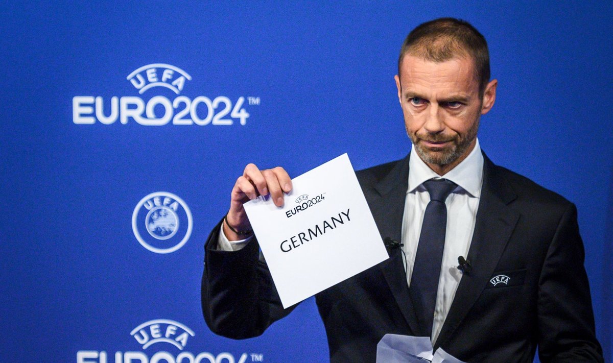 UEFA president Aleksander Ceferin näitab, et 2024. aasta EM toimub Saksamaal.