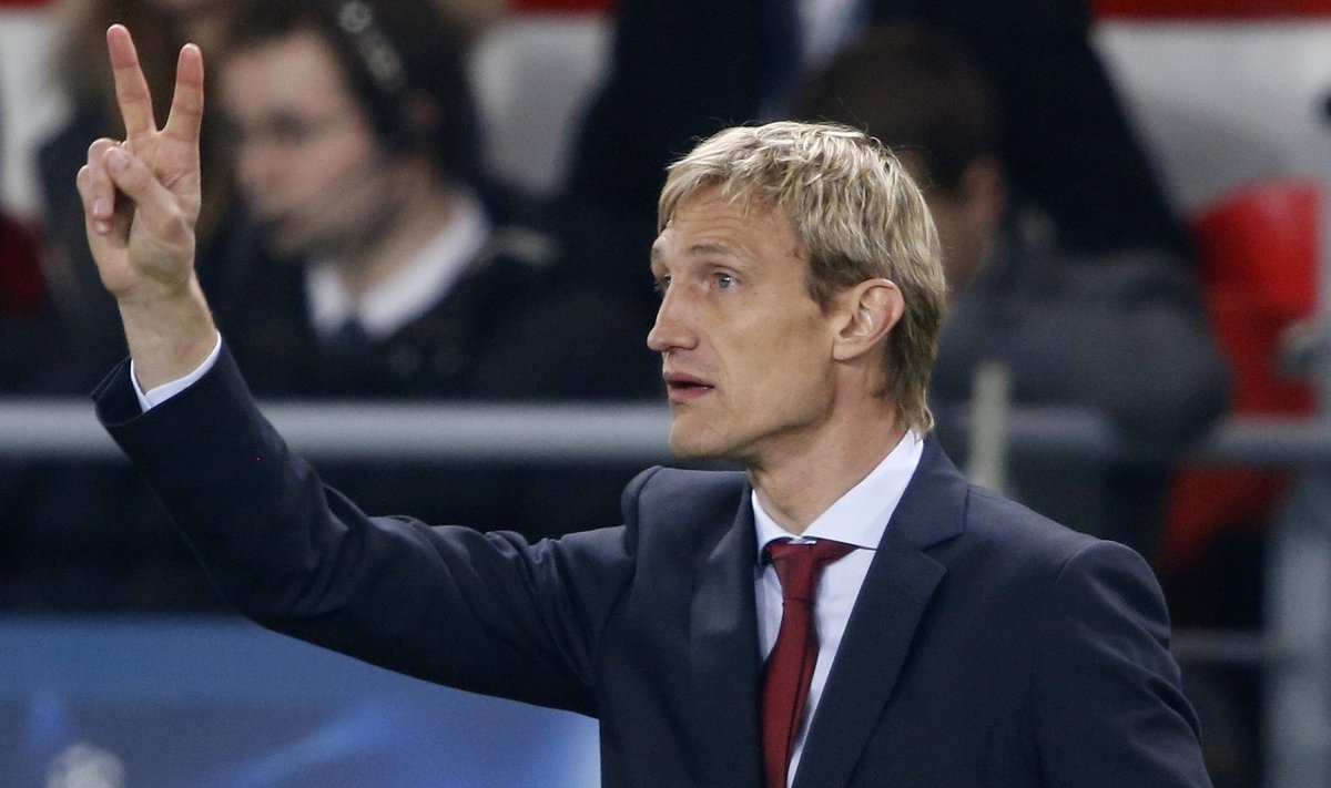 Bayer Leverkusen's coach Sami Hyypia directs his players during their Champions League round of 16 second leg soccer match Paris St Germain at the Parc des Princes Stadium in Paris
