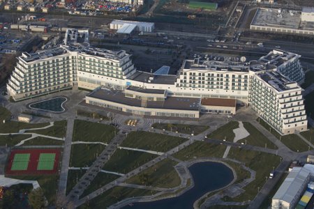 An aerial view from a helicopter shows AZIMUT Hotel Resort and SPA Sochi and the "Theme Park / Amusement Park" constructed by the JSC "Sochi Park" company in the Adler district of the Black Sea resort city of Sochi