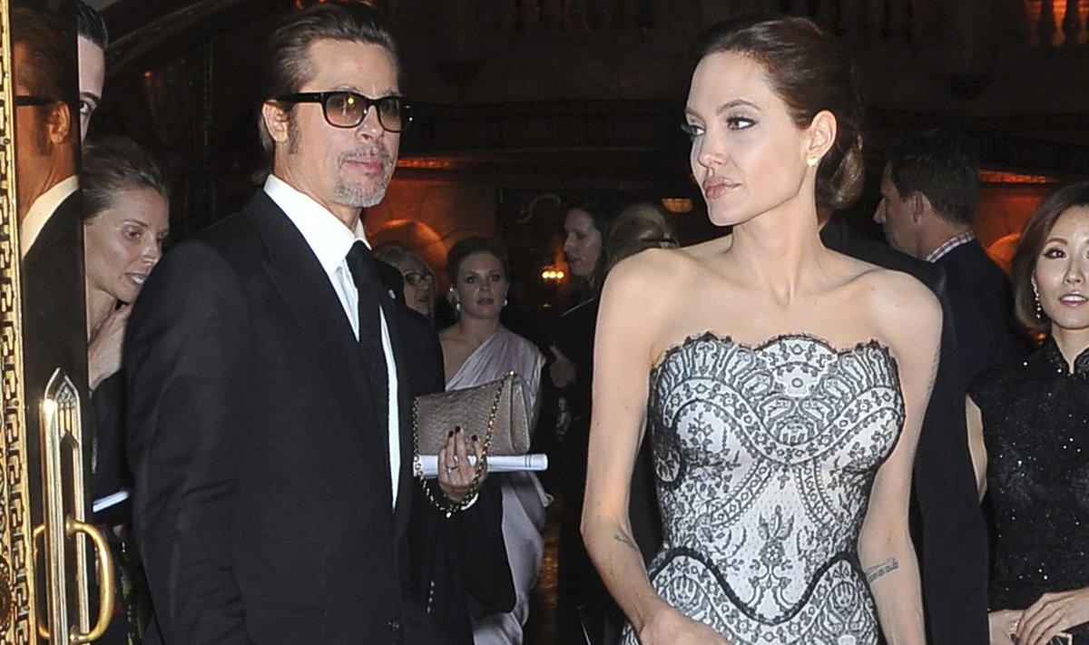 Angelina Jolie and Brad Pitt arrive on the red carpet at the world premiere of the film "Unbroken" in Sydney
