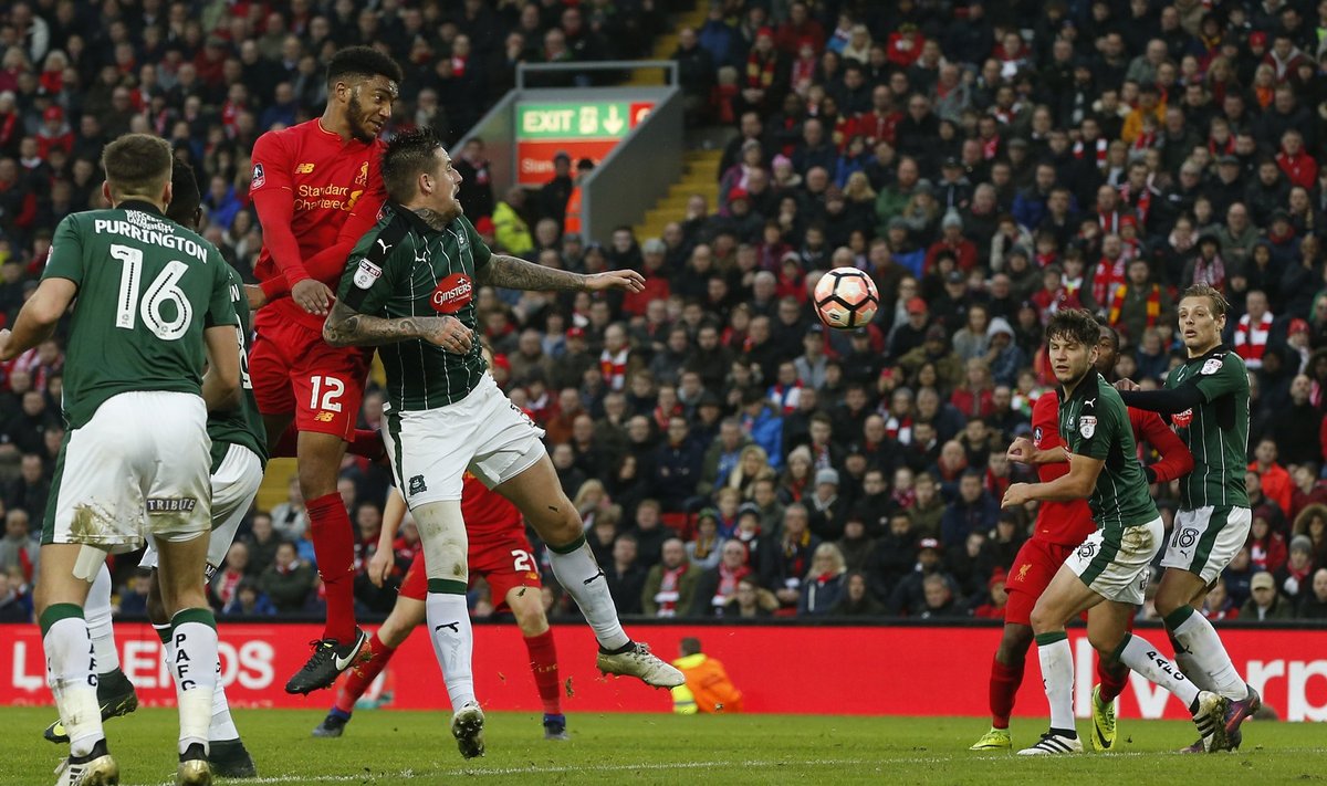 Liverpool's Joe Gomez heads at goal
