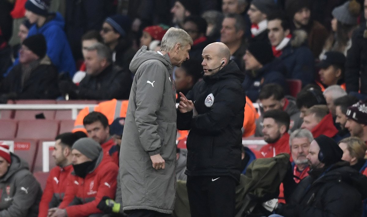 Arsenal manager Arsene Wenger clashes with fourth official Anthony Taylor before being sent to the stands